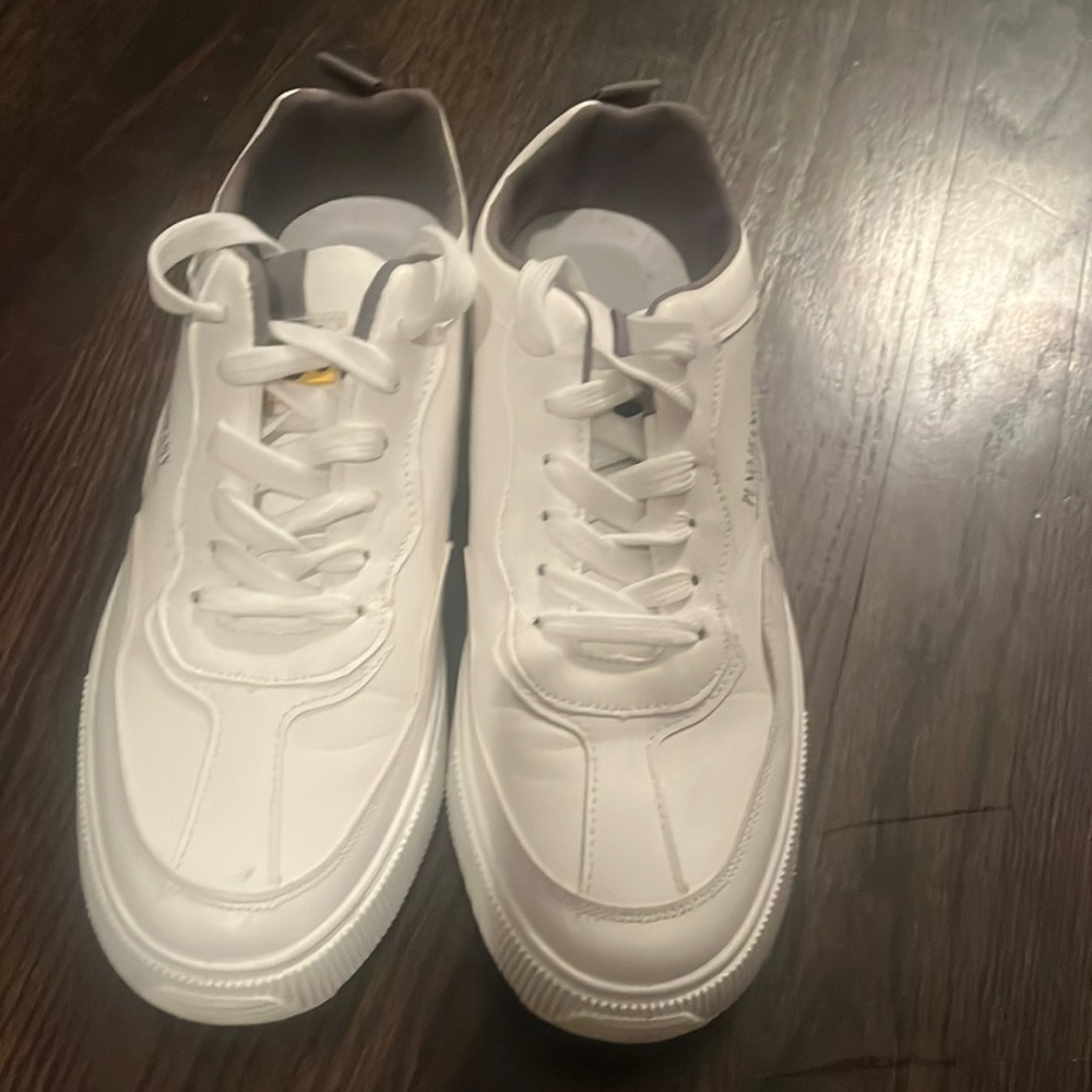 Really fashionable white sneakers. Worn one time.